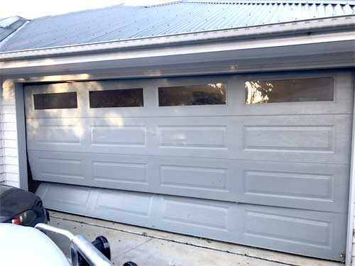 Vehicular impact on a garage door